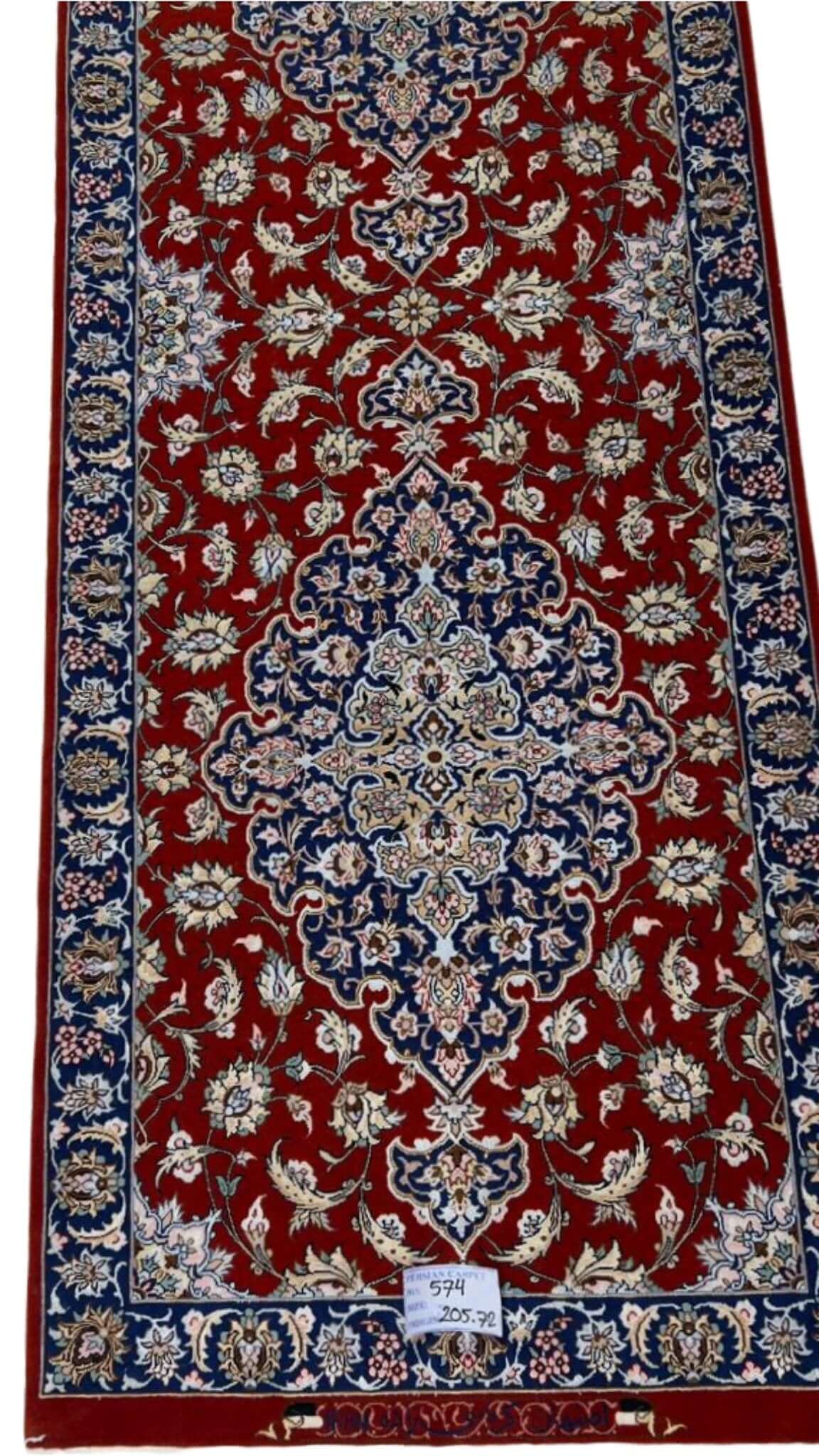 "Hand-knotted red Persian runner rug with traditional design and silk details"