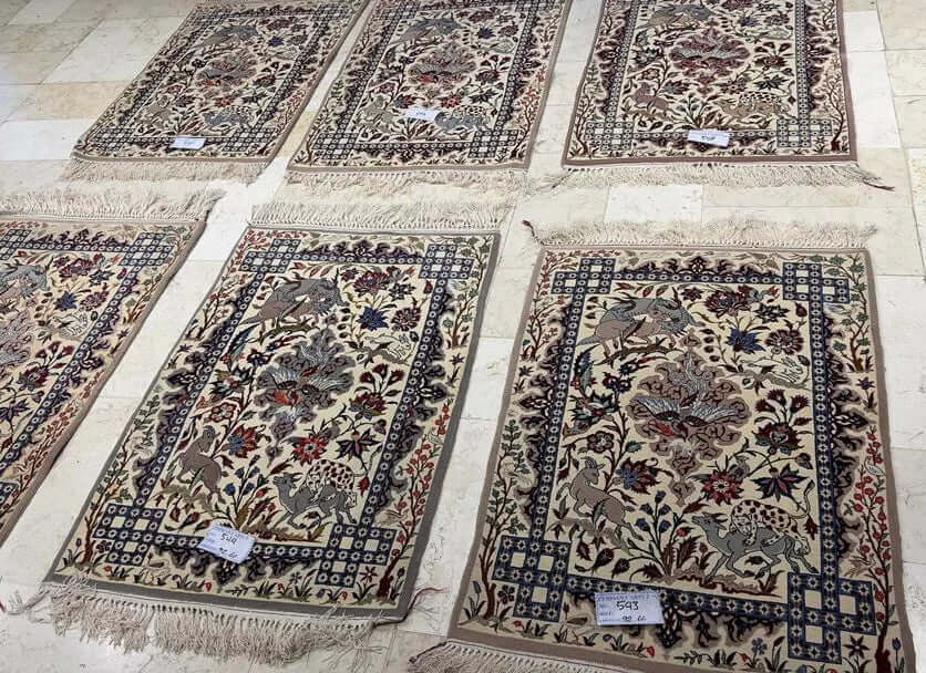 "Luxury Persian rug from Isfahan – 90x60 cm, featuring a detailed medallion design, crafted from wool and silk, perfect for traditional or modern interiors." ​​






