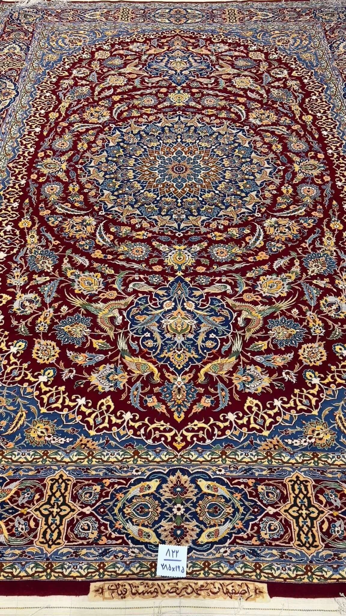 Close-up of the intricate blue and red patterns on the Isfahan Persian carpet