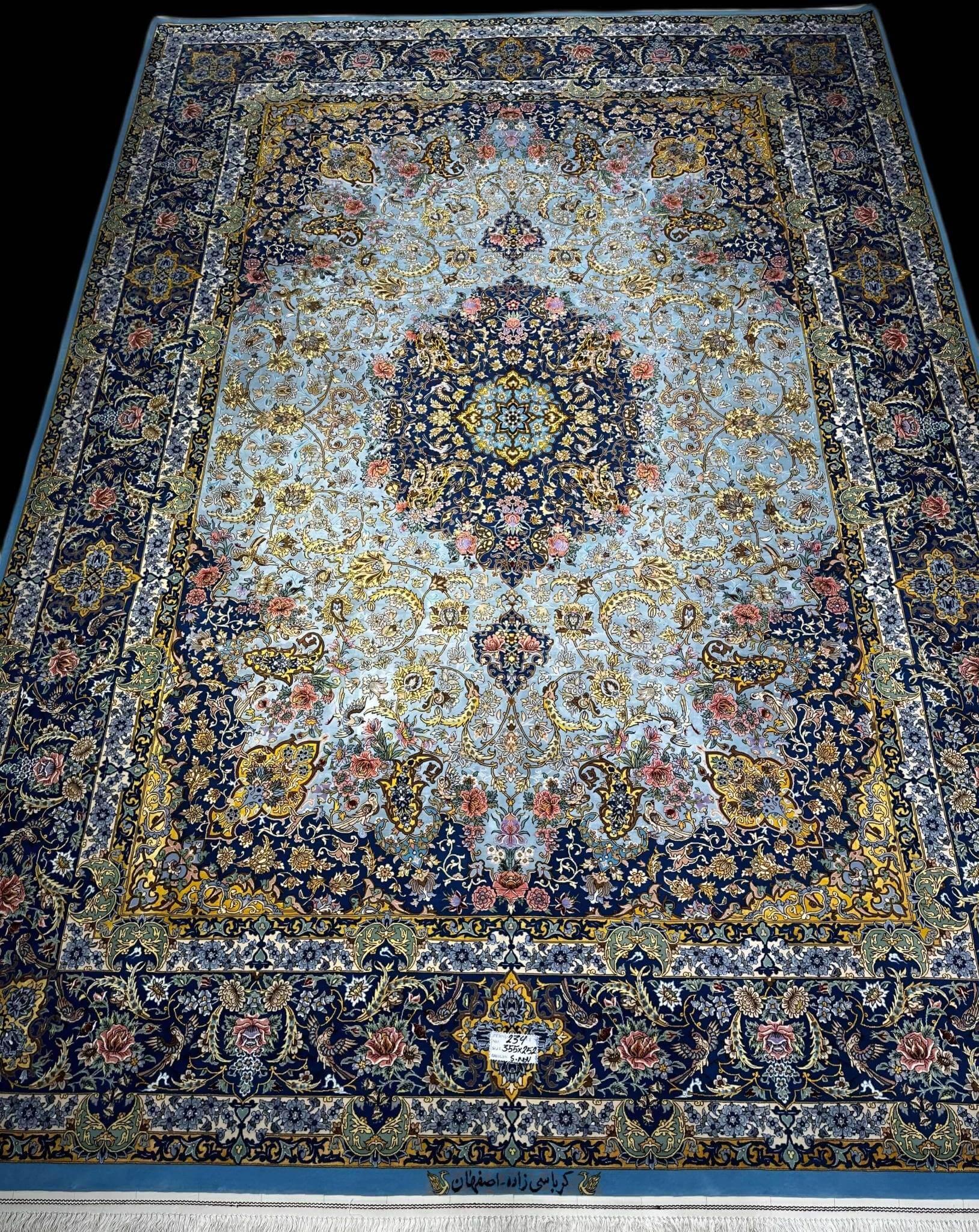 "Elegant Isfahan rug, 11.5 feet x 8.2 feet, featuring wool and silk pile with 810,000 knots per square meter."

