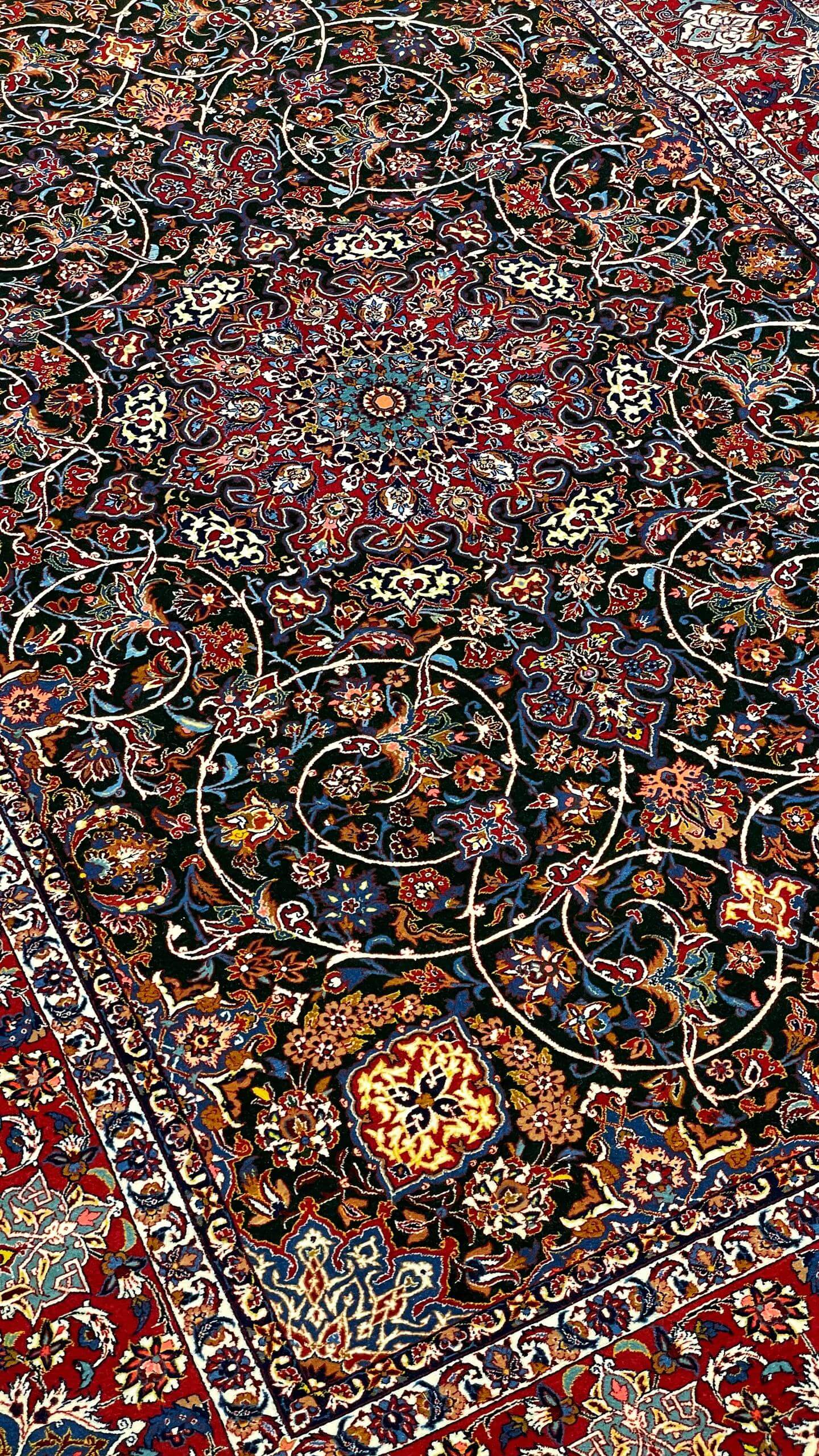 "Detailed corner view of the Seirafian carpet with traditional floral motifs."
