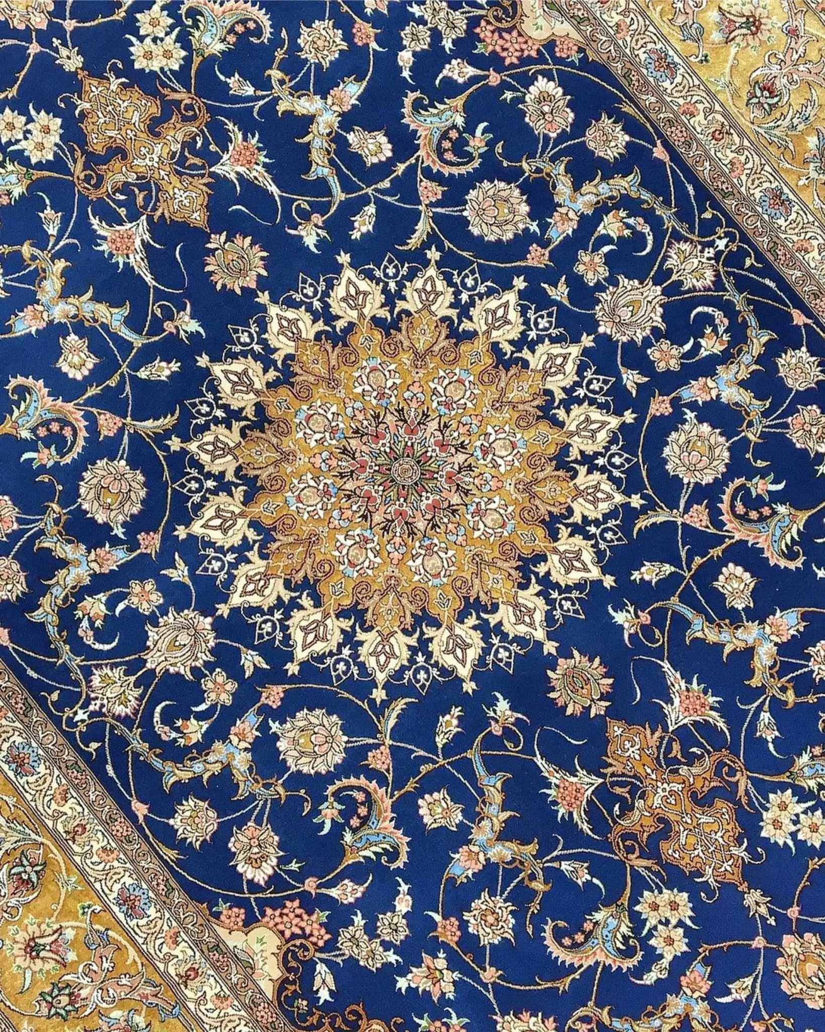 "Traditional Persian rug with intricate floral vine patterns and a striking golden medallion centerpiece."