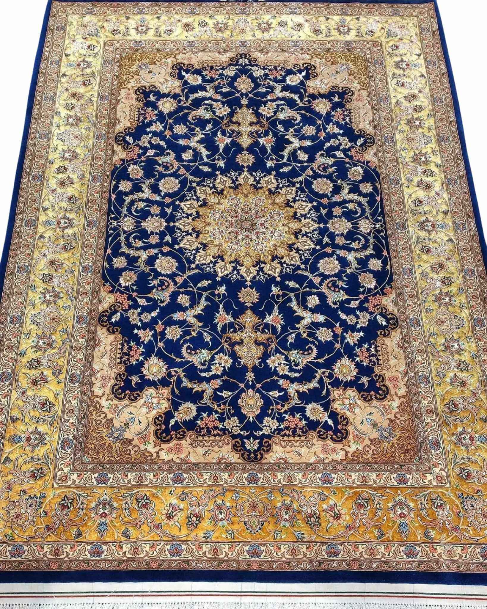 "Hand-knotted Isfahan Persian rug with a majestic navy blue background and golden floral medallion."