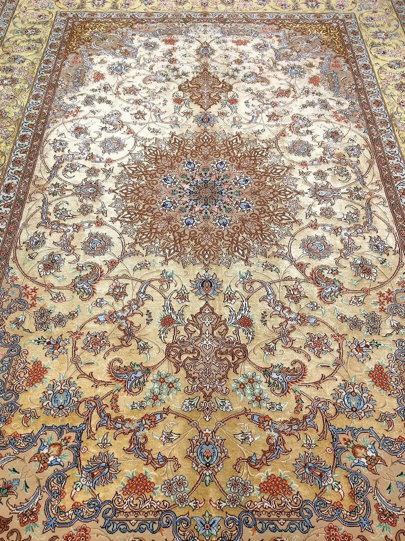 "Luxury Persian carpet featuring an intricate gold and ivory pattern, perfect for elegant interiors and collectors."