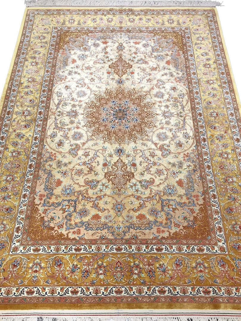 "Hand-knotted Isfahan Persian rug with a golden floral medallion design, crafted from fine wool and silk."