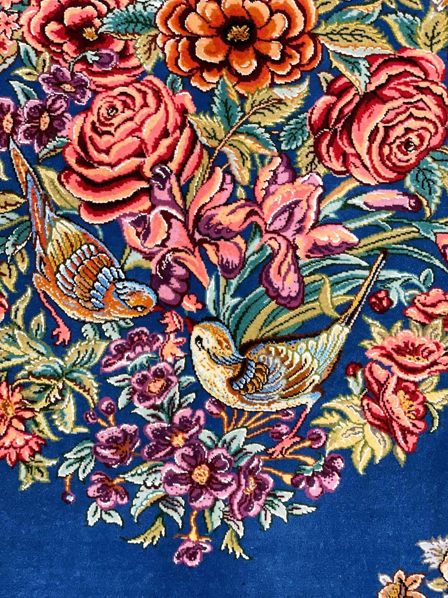 "Small Persian silk rug for wall hanging or accent décor, showcasing a traditional floral bouquet and bird design."