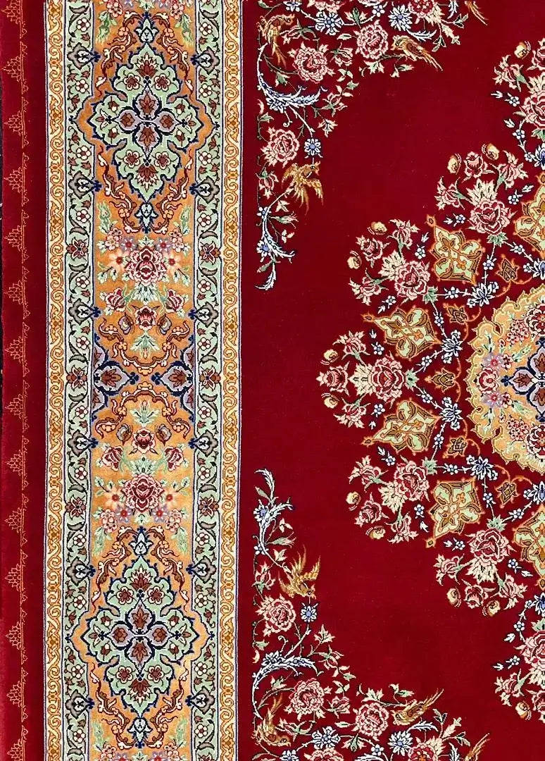"Authentic handmade Persian rug with a stunning medallion, floral motifs, and luxurious silk detailing."