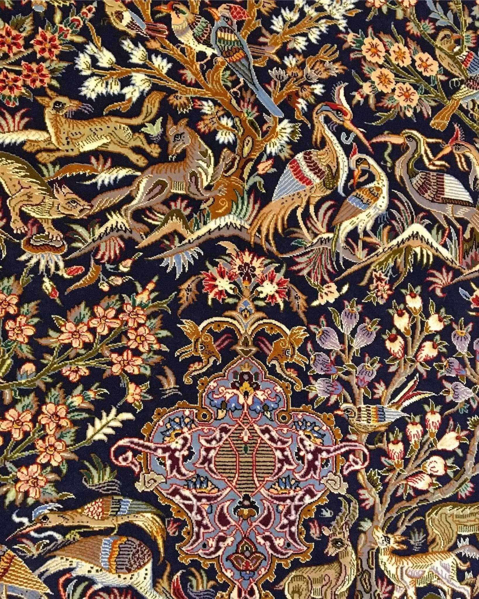 "Premium handmade Persian rug with birds, floral vines, and wildlife on a black background."