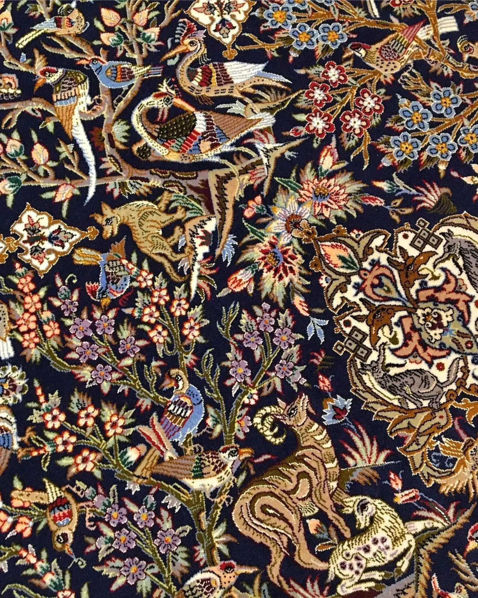 "Persian hunting scene rug with silk highlights, handwoven in Isfahan, Iran."