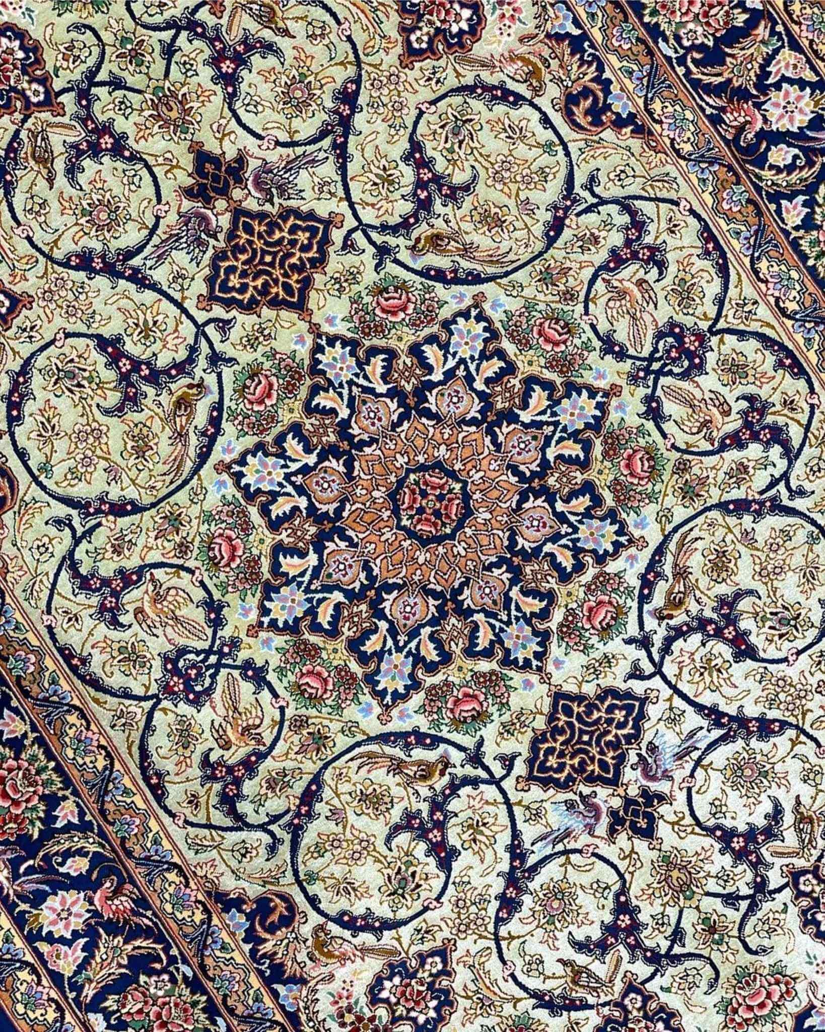 "Close-up view of handmade Isfahan rug, showcasing intricate floral and geometric designs in silk and wool."
