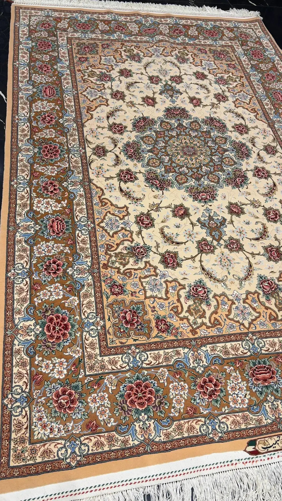 "Traditional Persian rug handmade in Isfahan, featuring a silk warp and wool-silk pile, measuring 220 cm x 150 cm. High-quality craftsmanship with intricate designs and vibrant colors."

