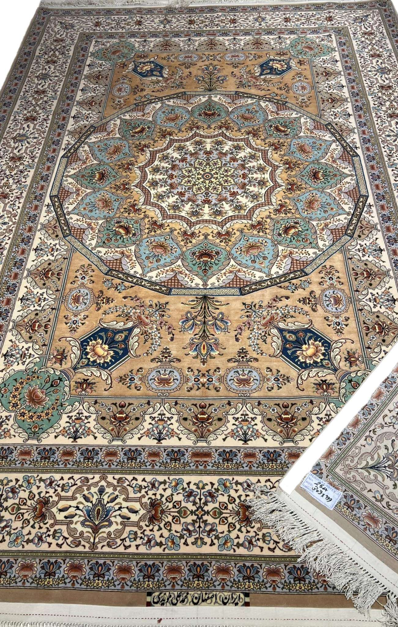 "Hand-knotted Persian Isfahan rug featuring intricate floral and medallion patterns by Master Moaiedie."
