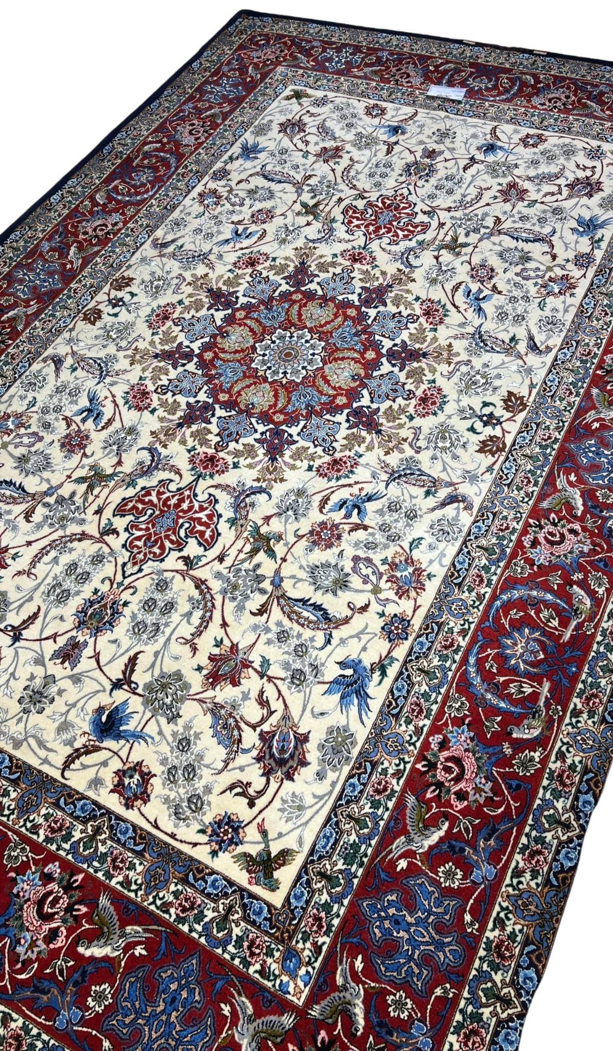 Hand-knotted Persian rug with wool and silk, red and cream colors