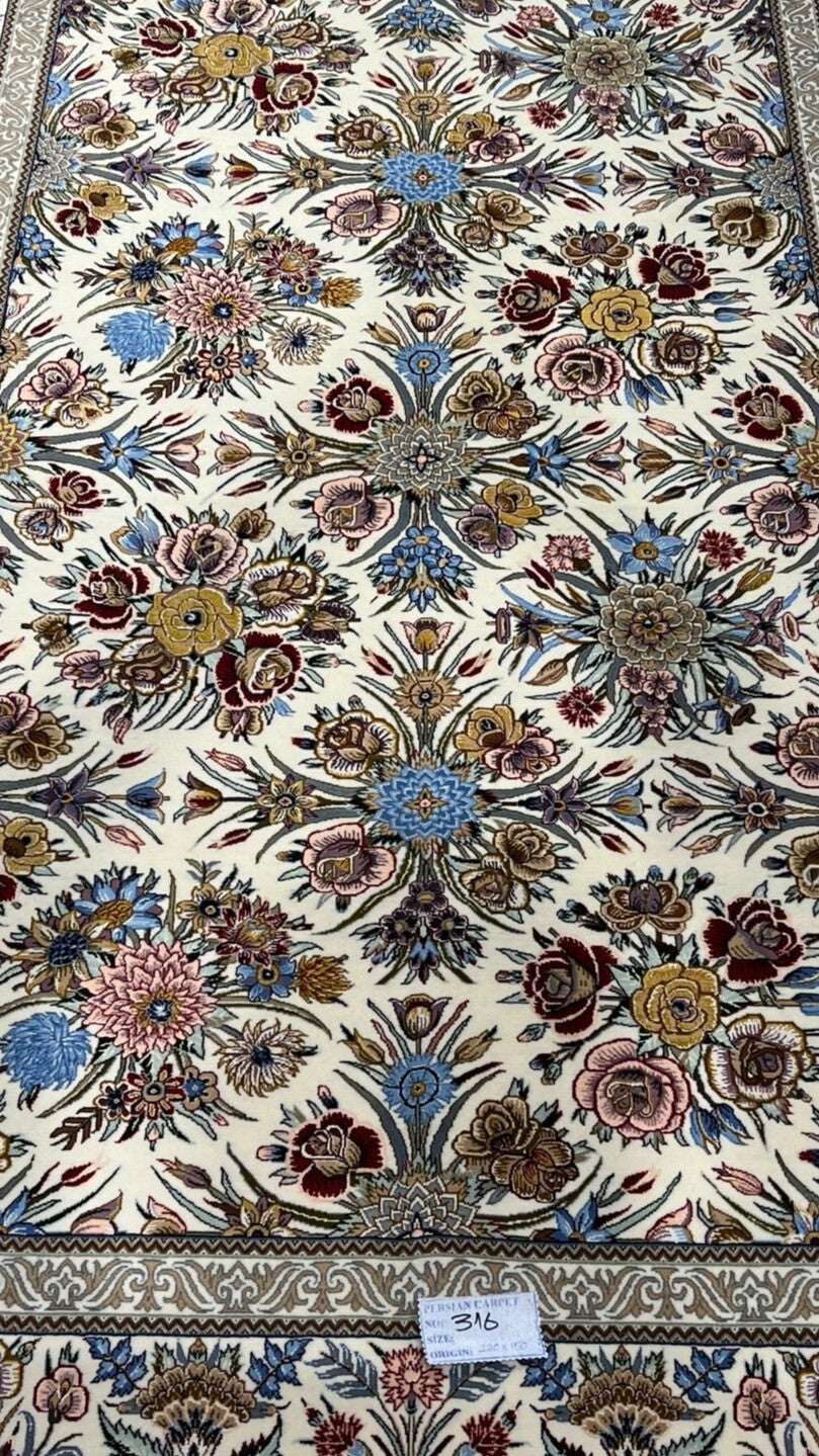 "Floral design on Isfahan Persian rug, hand-knotted with silk and wool."