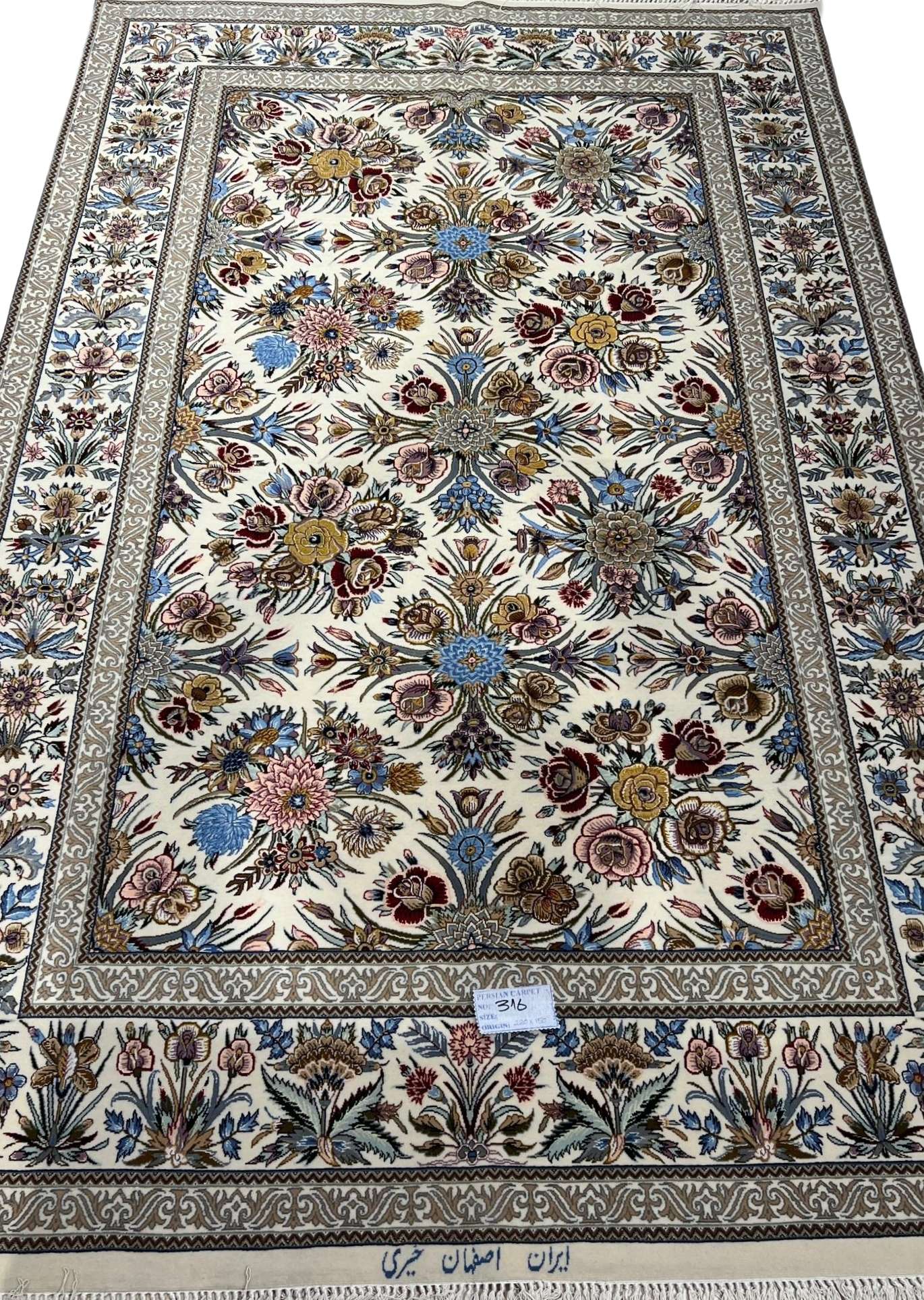 "Floral design on Isfahan Persian rug, hand-knotted with silk and wool."