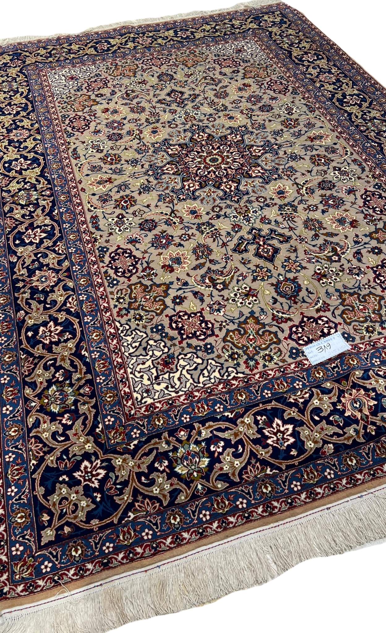 "Side view of the 70-year-old hand-knotted Isfahan rug with wool and silk blend."