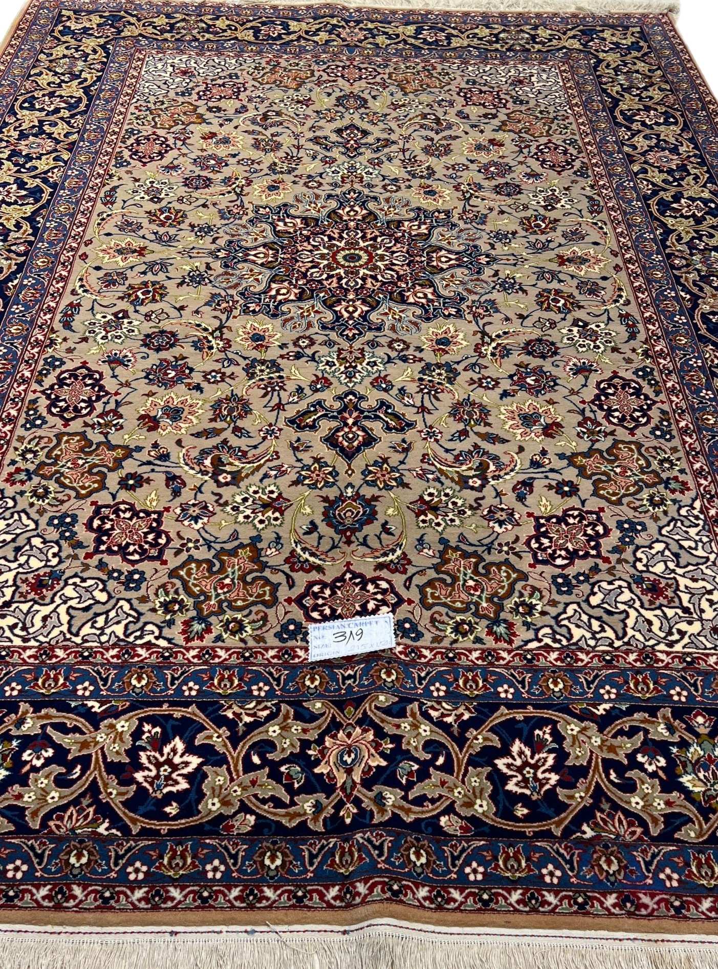 "Antique Isfahan rug, 70 years old, hand-knotted with floral patterns, 7 x 4.9 feet."