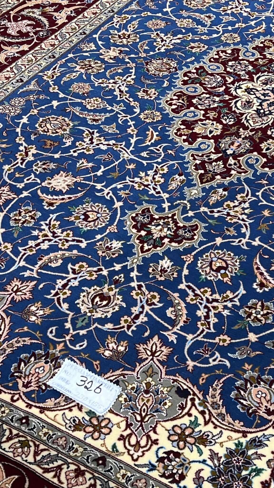 "Traditional Persian carpet with 700,000 knots per square meter, elegantly designed for fine interiors."
