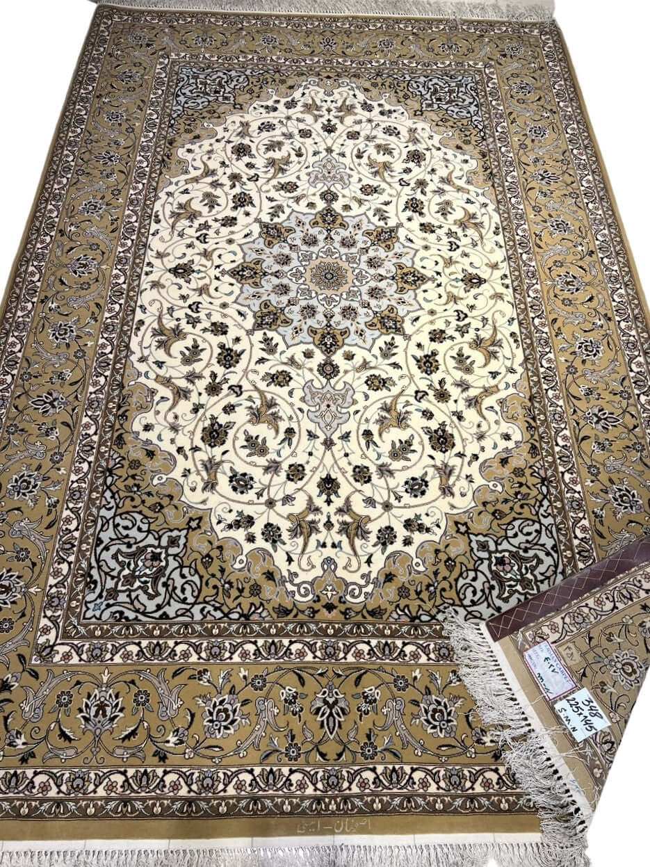 "Hand-knotted Islimi rug design from Isfahan, 225x145 cm, made by Weaver Aminie using wool and silk with intricate floral motifs."