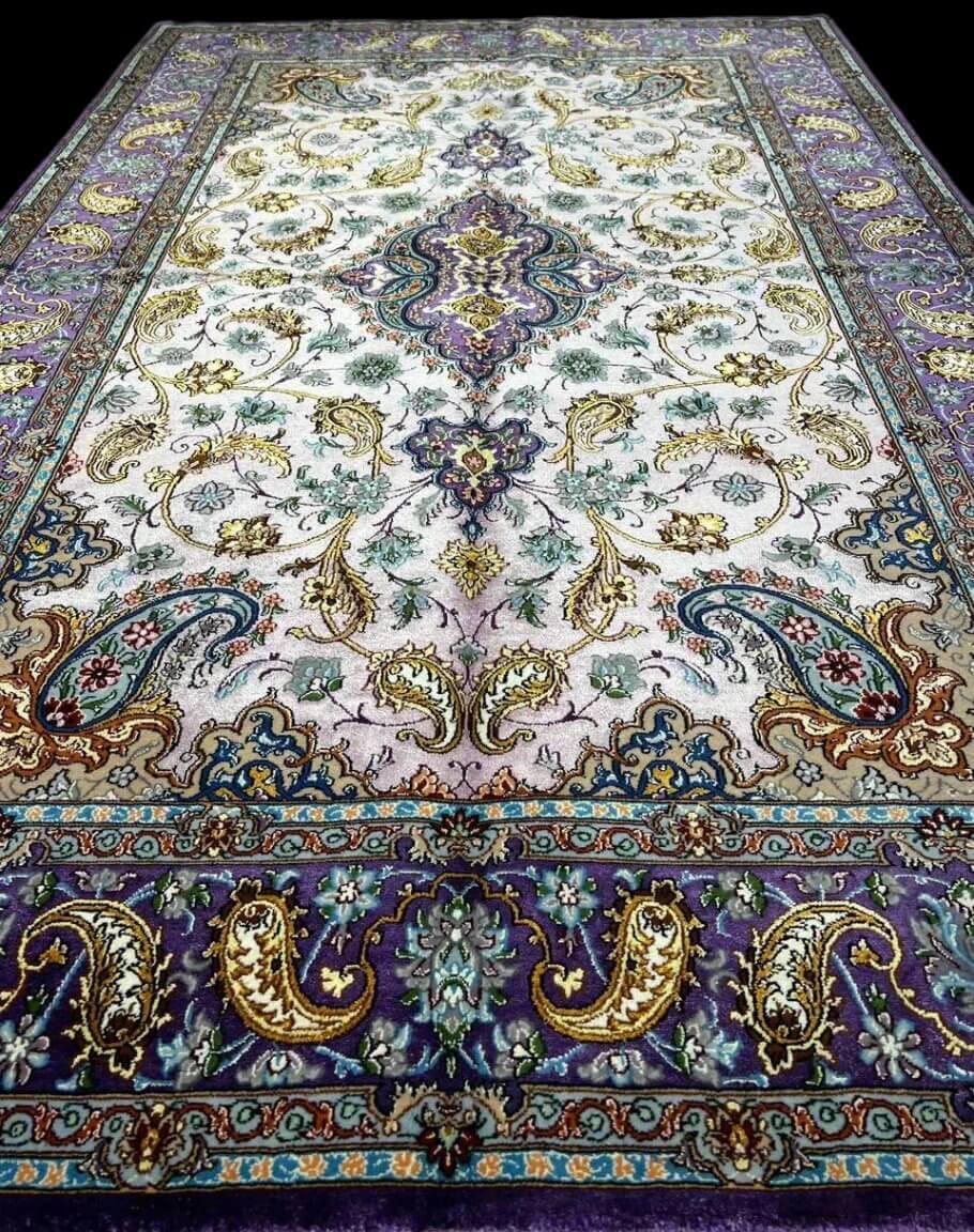 "Luxury Persian carpet with intricate paisley patterns and gold-accented floral motifs."