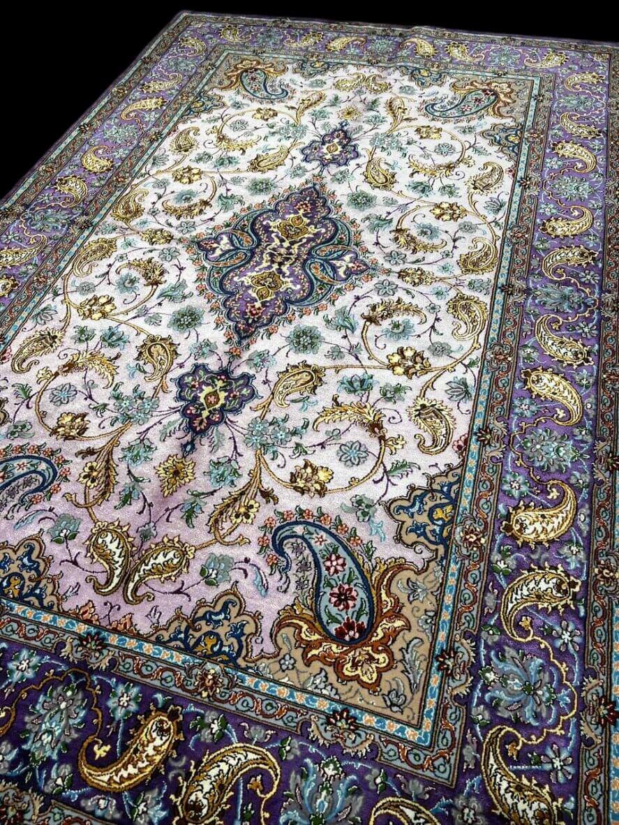 "Authentic Isfahan rug in 90% silk and wool, featuring traditional Persian craftsmanship."