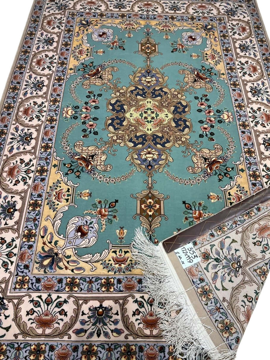 "Persian Isfahan rug with aqua green floral medallion design and ivory border, hand-knotted by Master Moaeidie."
