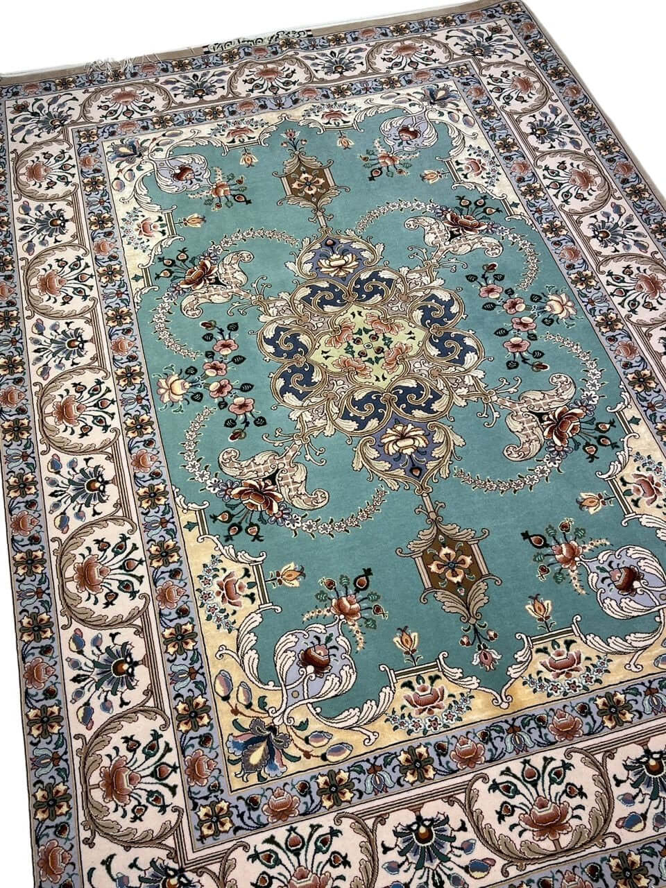 "Exquisite Persian rug measuring 172 x 119 cm with hand-knotted silk and wool detailing."

