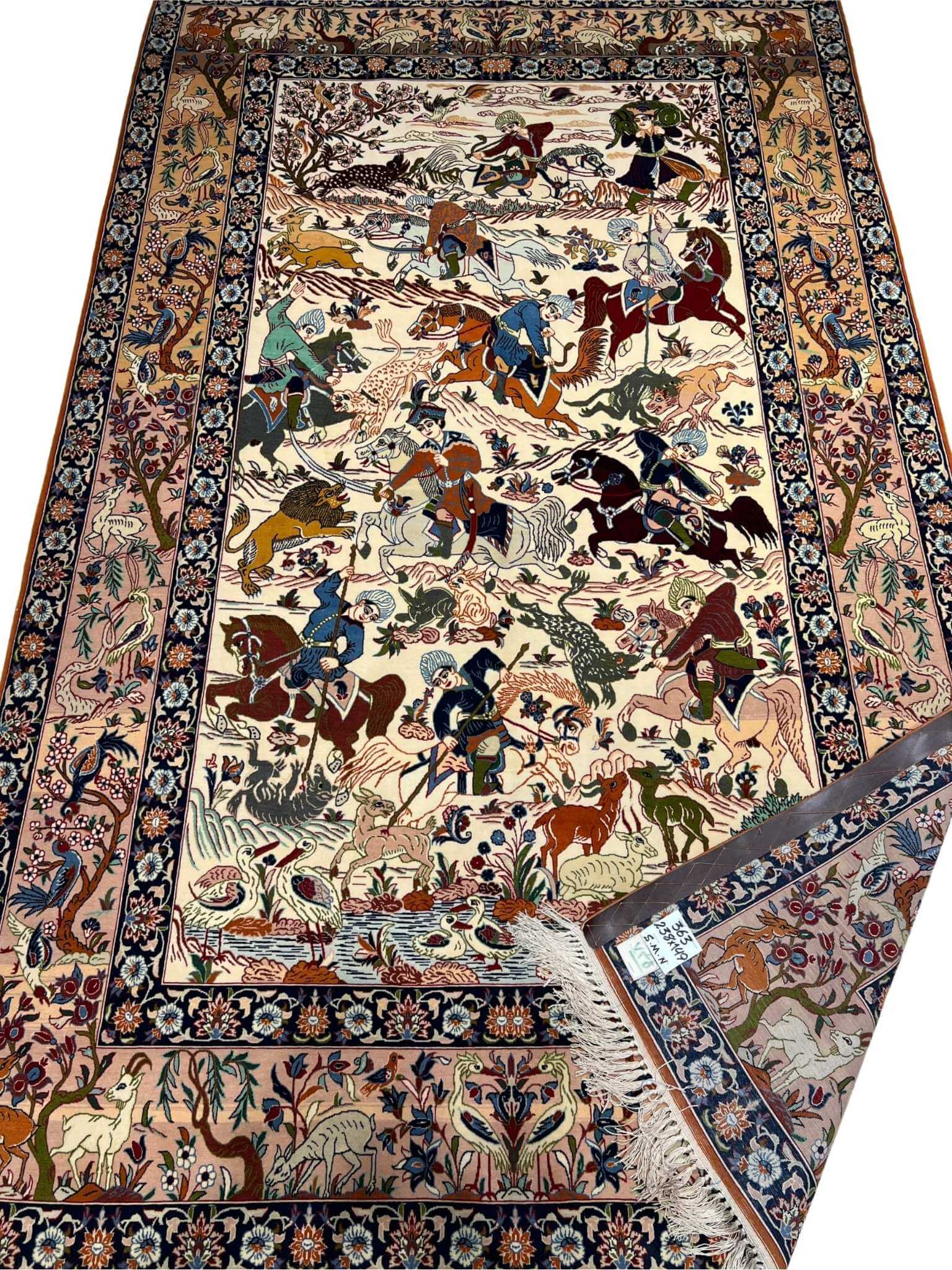 "Isfahan rug depicting a traditional hunting scene with wildlife motifs"
