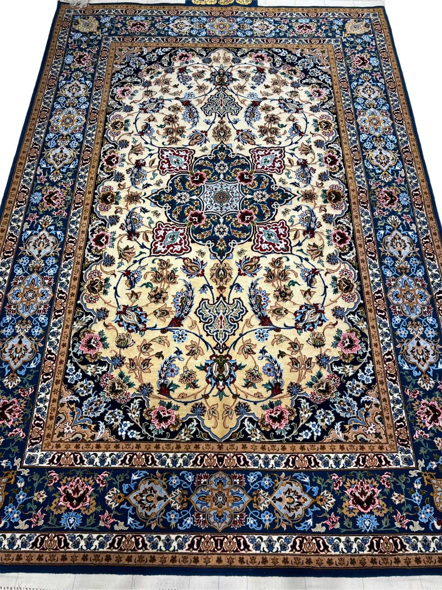 Hand-knotted Isfahan Persian rug with navy blue and golden tones.