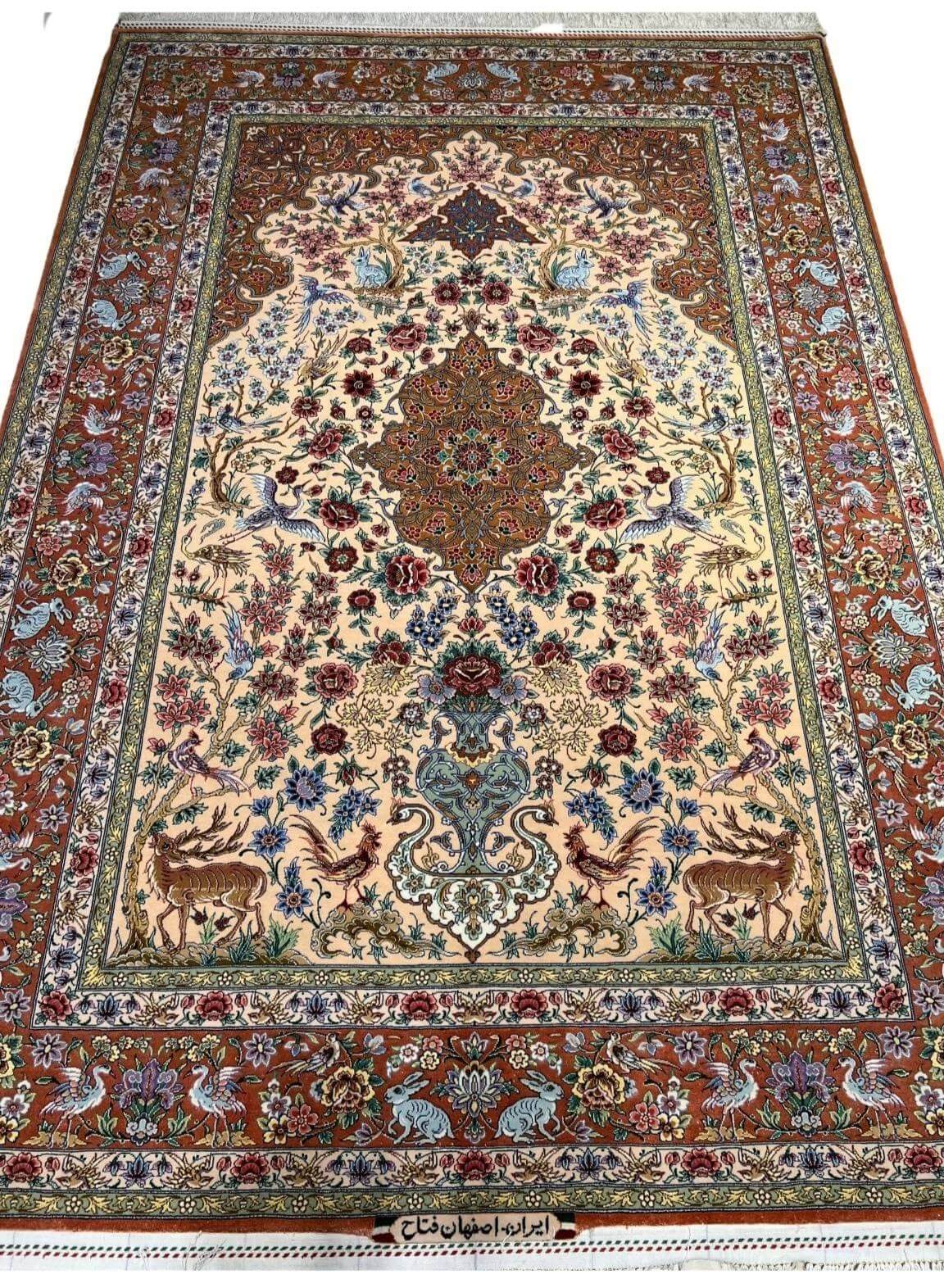 "Luxury Isfahan Persian rug, hand-knotted with silk and wool, featuring wildlife and floral medallion patterns."