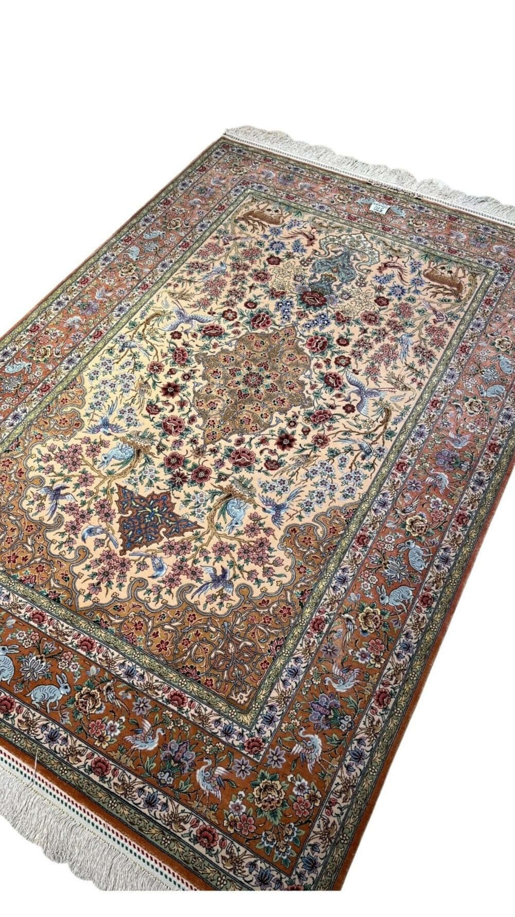 "Collectible Isfahan rug with vibrant natural dyes, fine silk warp, and exquisite Persian craftsmanship."