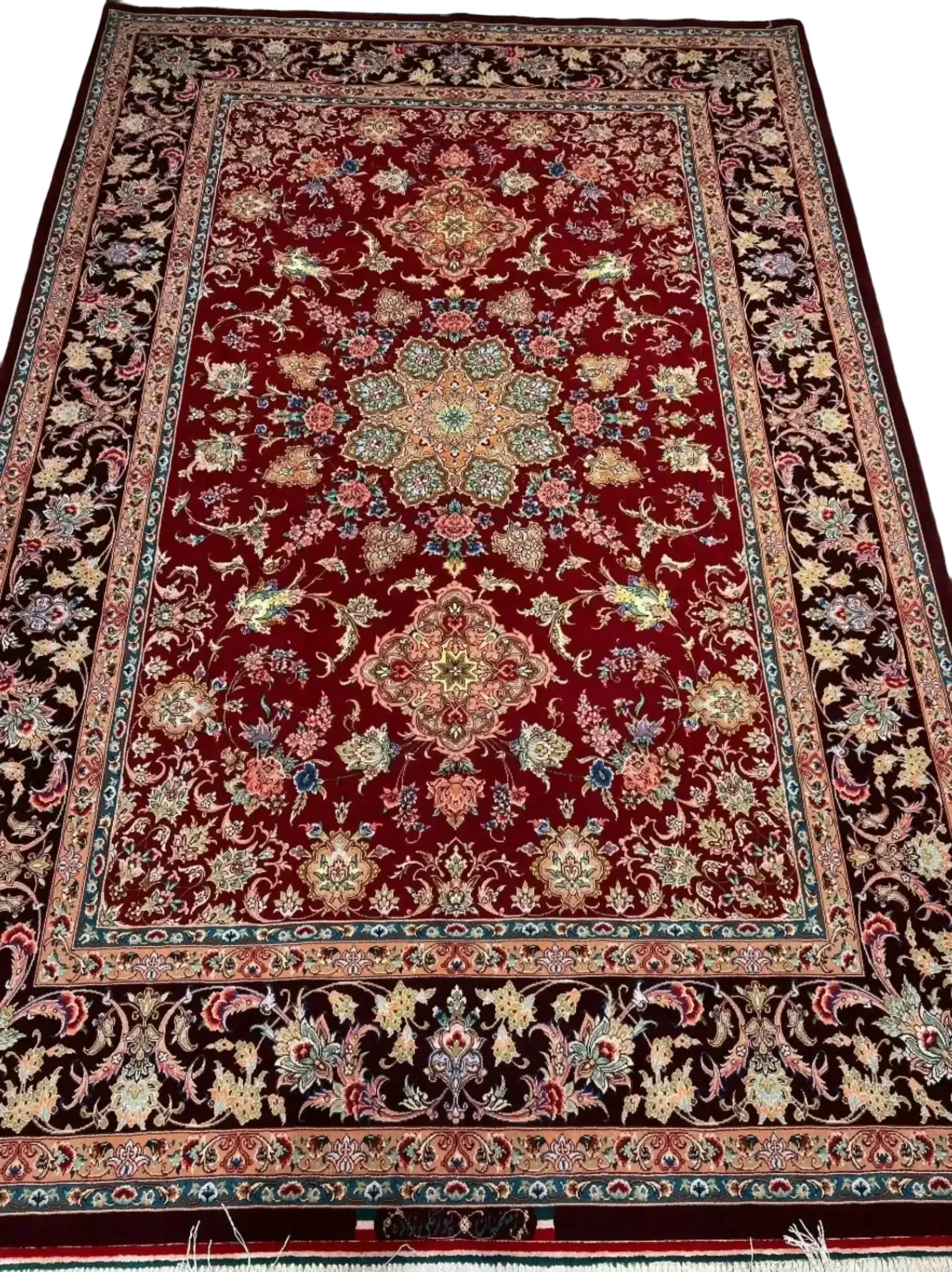 An Isfahan Persian rug featuring intricate red and blue patterns