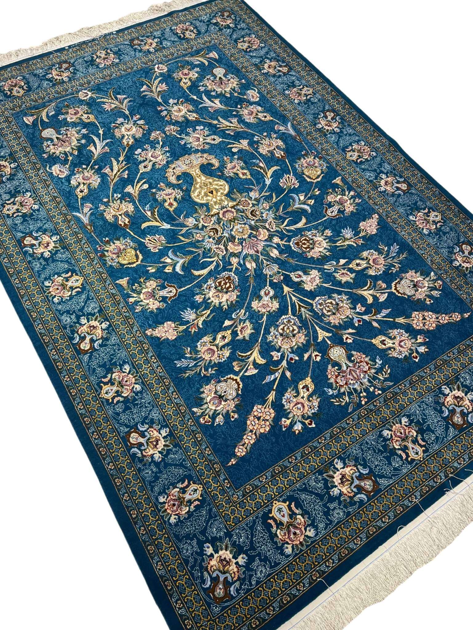 High-quality Isfahan carpet with intricate cascading floral patterns.
