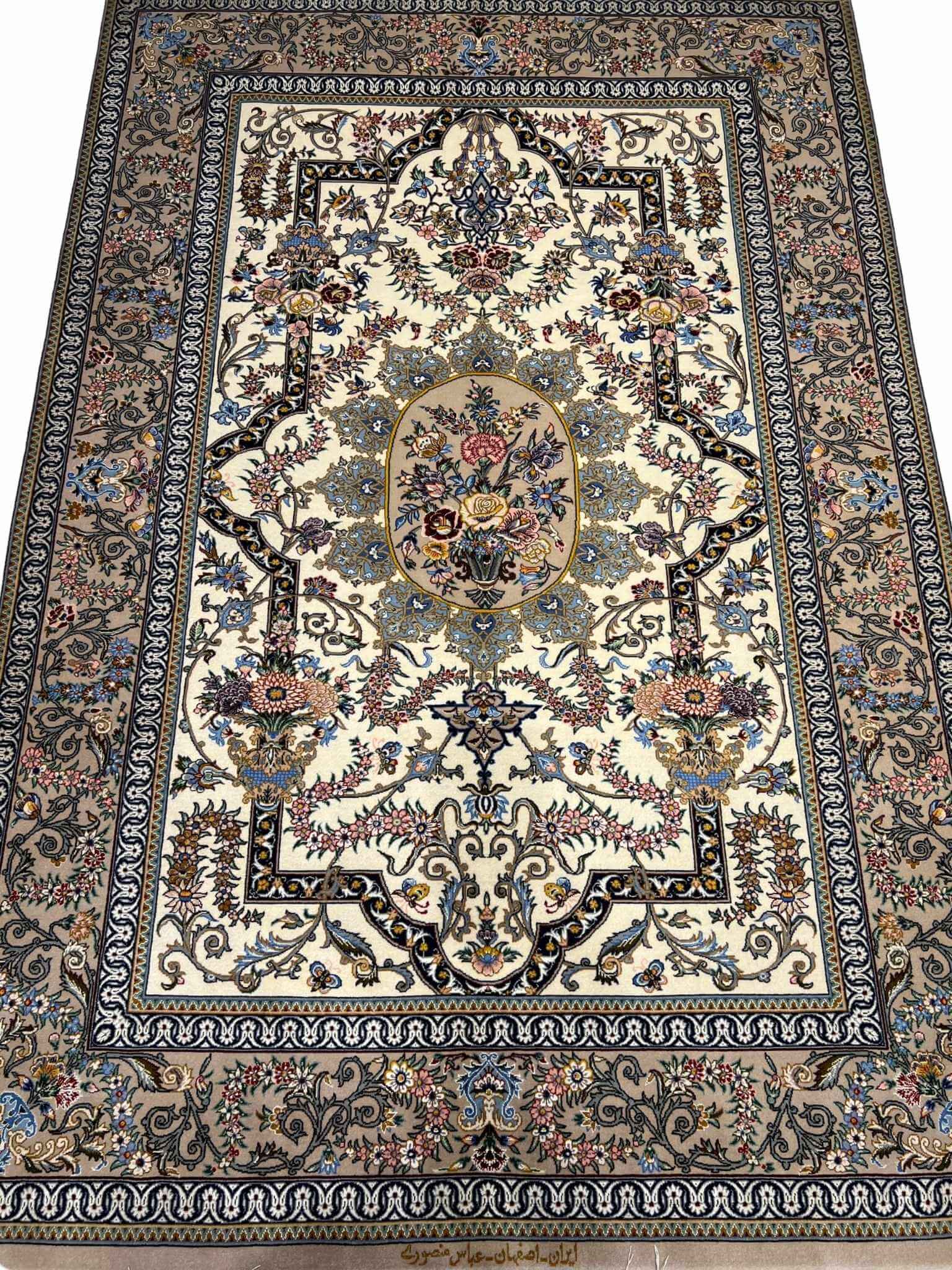 "Hand-knotted Persian rug with intricate floral medallion design, crafted by Mansourie in Isfahan, 200 x 120 cm."
