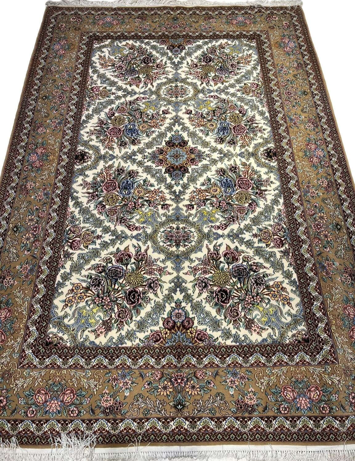 "Hand-knotted Persian carpet in beige and floral design from Isfahan."
