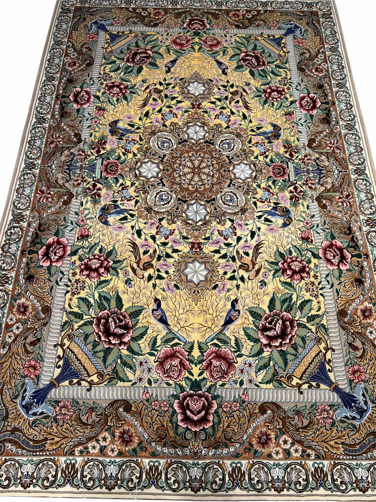 Persian Isfahan rug with Ghajar floral design and bird motifs.
