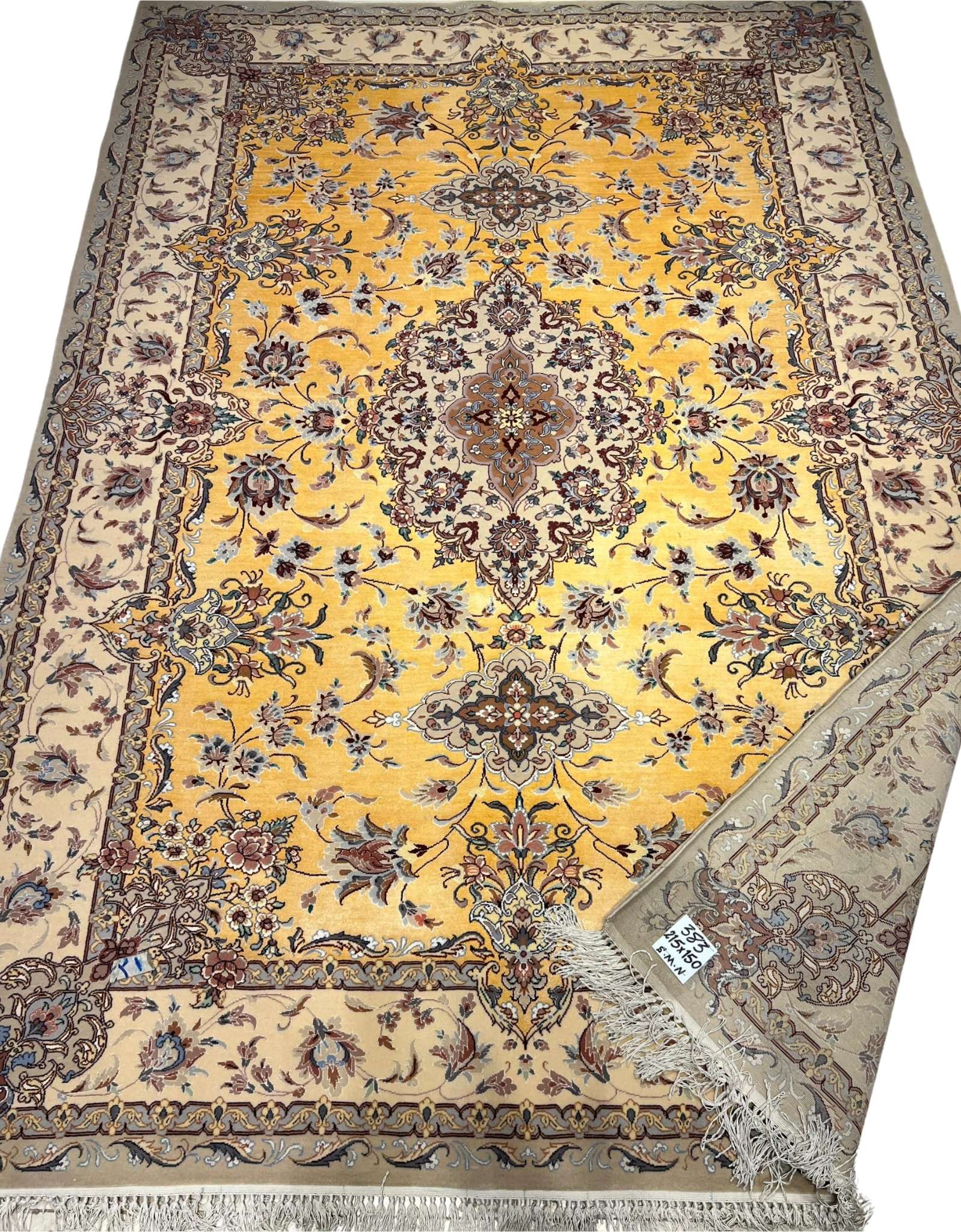 Luxurious beige and yellow silk rug with decorative motifs