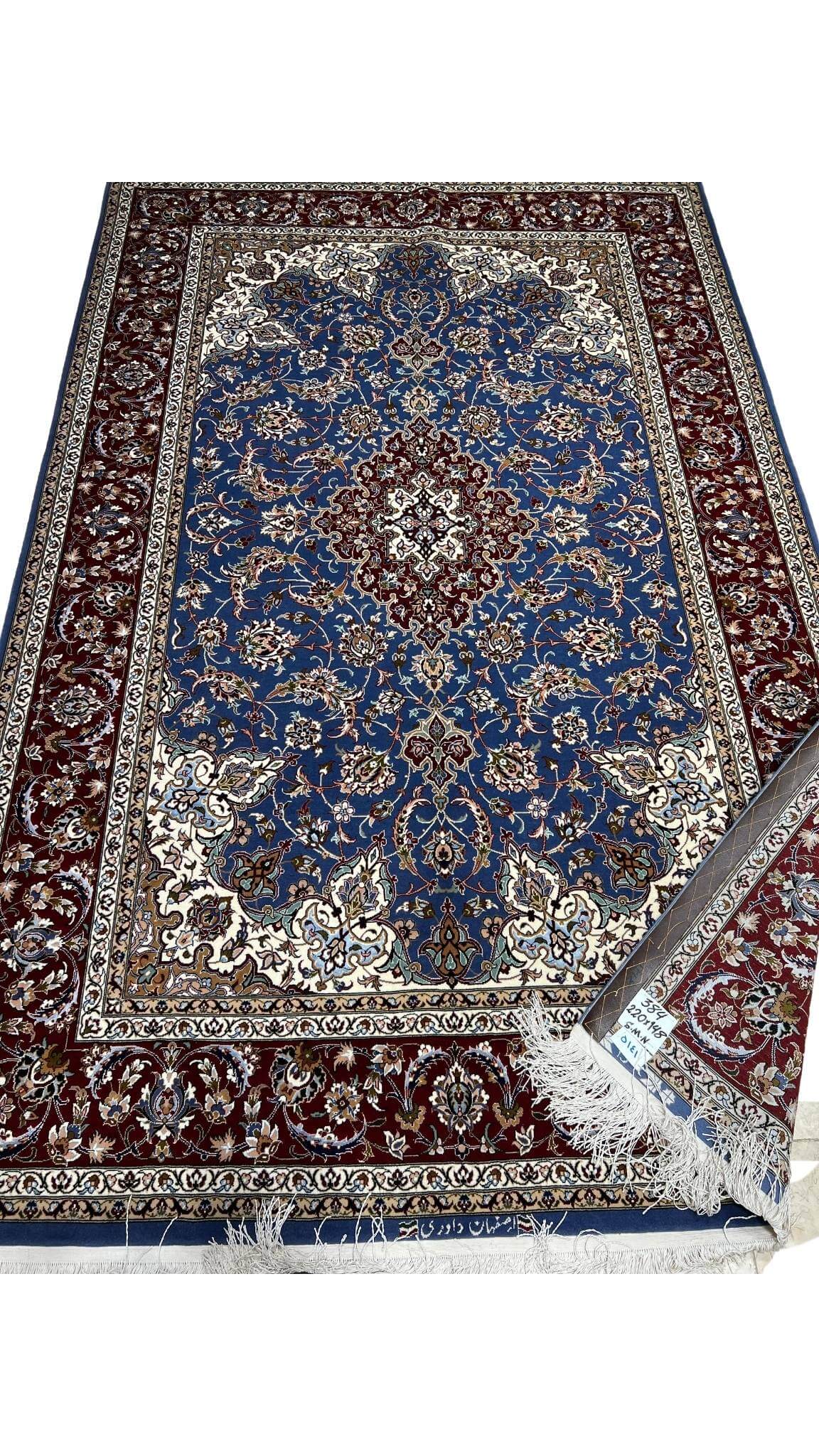 "Handcrafted Isfahan rug showcasing a central medallion design with high knot density."
