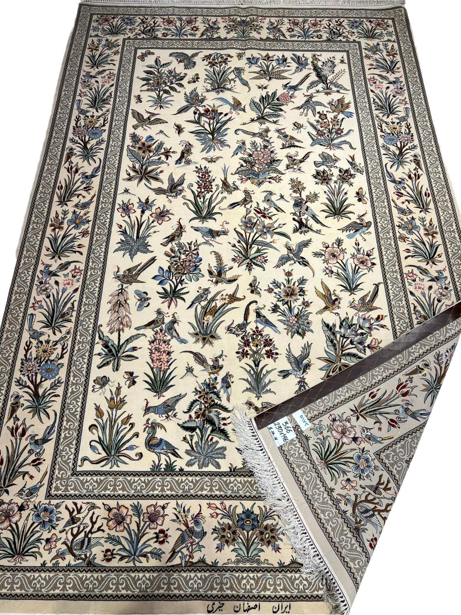 "Authentic Persian floral rug with intricate botanical and bird motifs, handwoven in Isfahan, Iran."