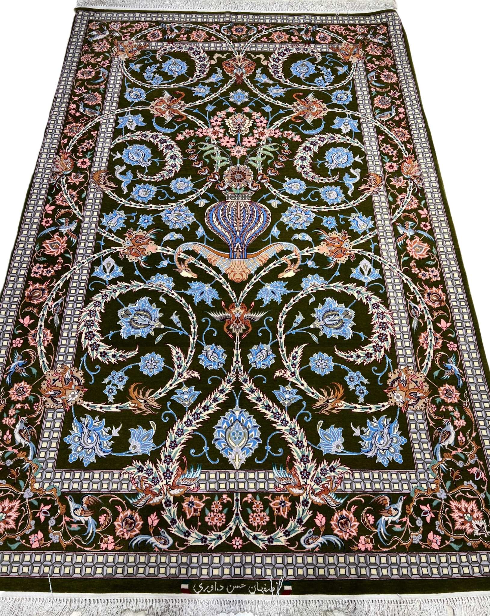 Persian Isfahan floral vase rug with emerald-green base.
