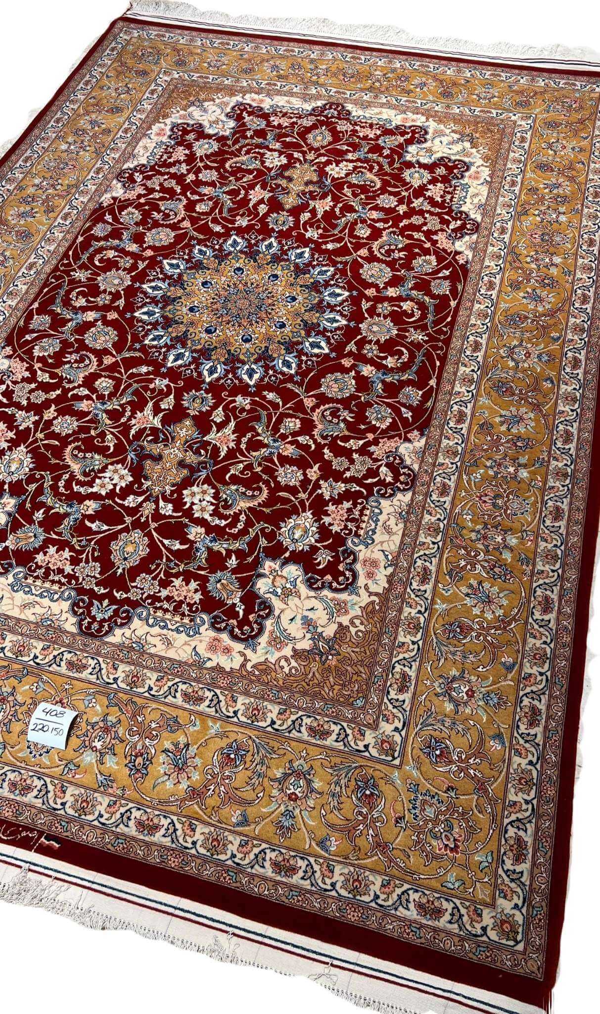"Authentic Persian floral rug with an intricate medallion pattern, handwoven in Isfahan, Iran."