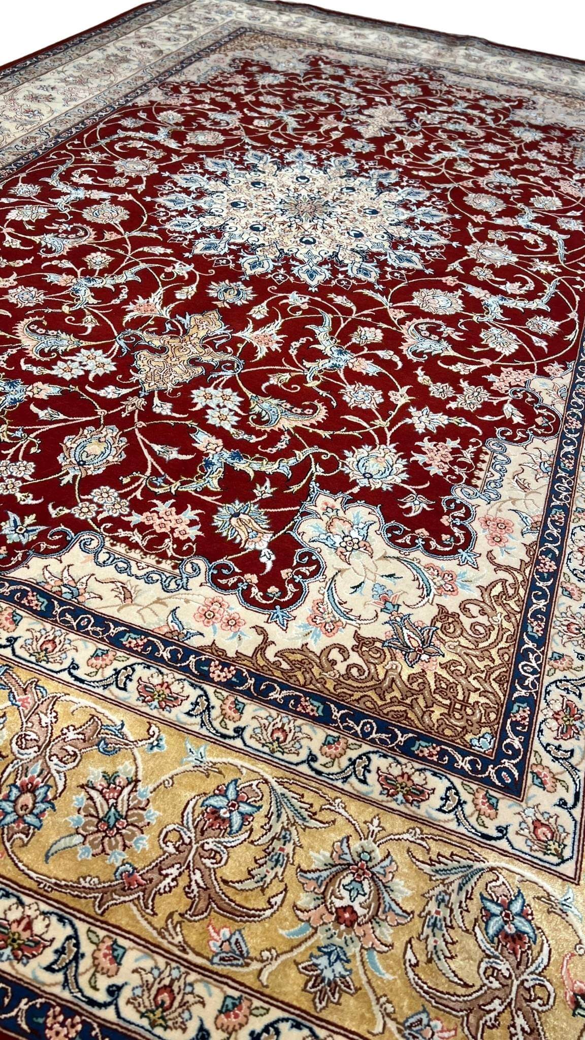 "Exquisite silk and wool Persian carpet – luxury hand-knotted Isfahan rug in red, gold, and beige tones."
