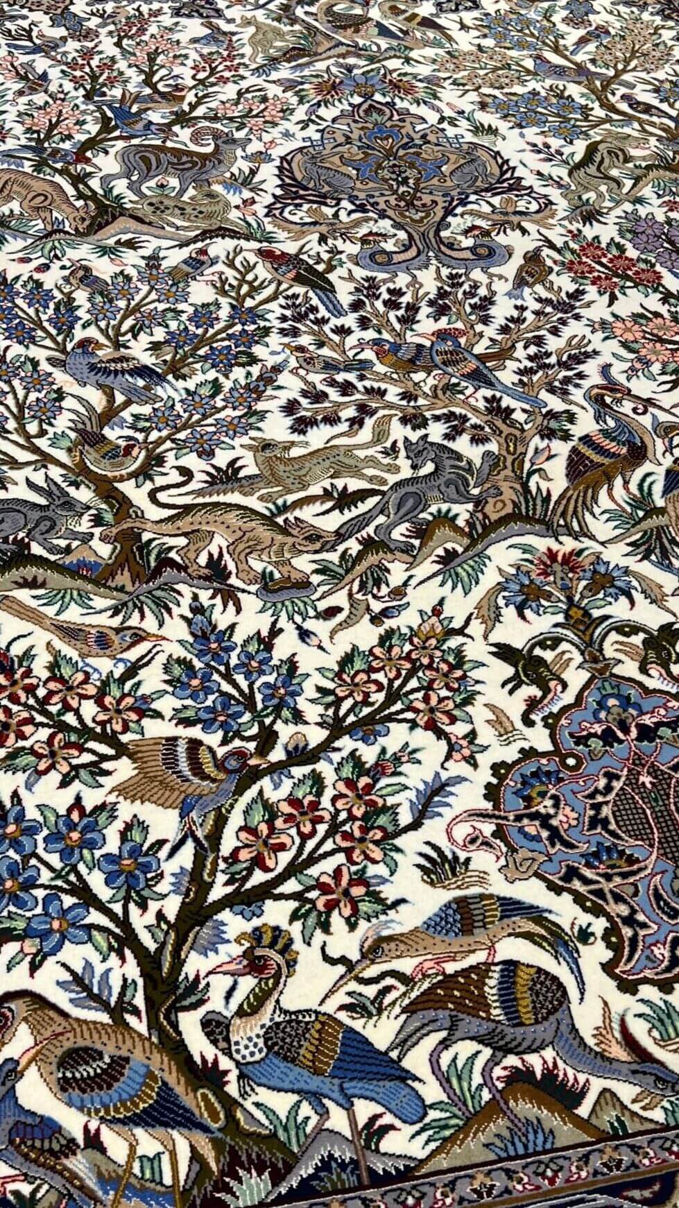 "Exquisite Persian carpet from Isfahan, featuring a classic hunting design, intricate hand-knotting, and luxurious silk accents."