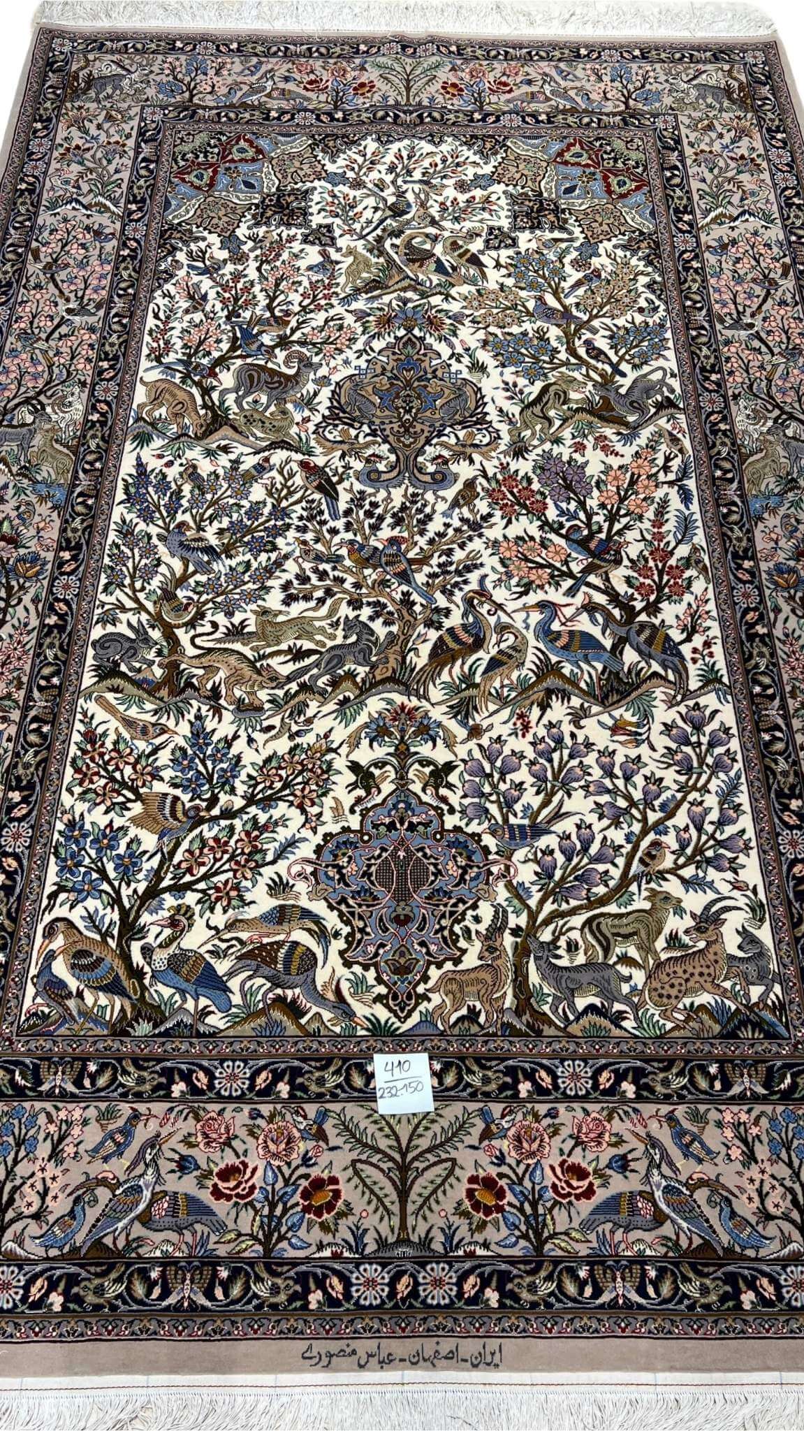 "Isfahan Persian hunting scene rug with hand-knotted silk and wool design featuring birds and deer, 232 x 150 cm."