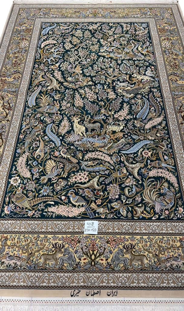 "Luxury Isfahan Persian rug with silk and wool, hand-knotted hunting scene carpet featuring deer, birds, and floral motifs."