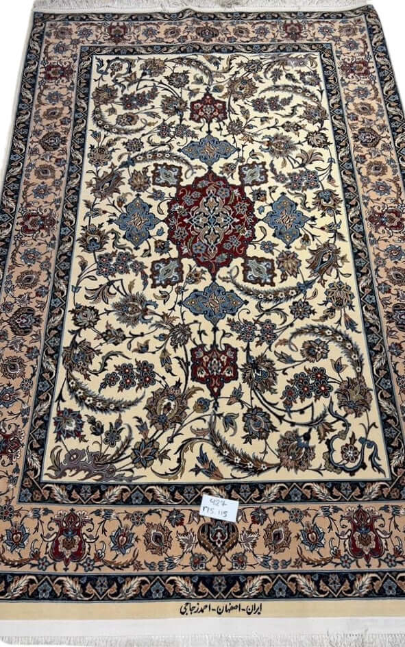 "Hand-knotted Persian rug from Isfahan, Iran, showcasing intricate craftsmanship with silk and wool blend. Designed by Master Ahmad Zojaji, this authentic 175x115 cm Persian rug features a high knot density of 1,000,000 knots/m², perfect for adding timeless elegance to your home décor."
