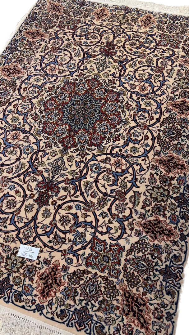 "Timeless Isfahan rug, 70 years old, featuring traditional Persian craftsmanship."
