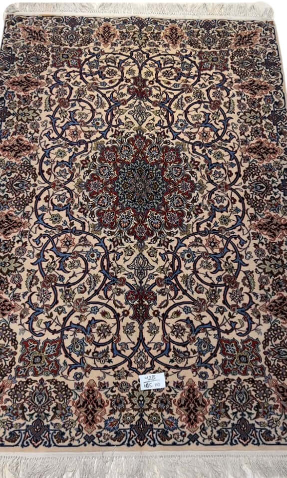 "Semi-antique Isfahan Persian rug with beige, red, and blue floral motifs."
