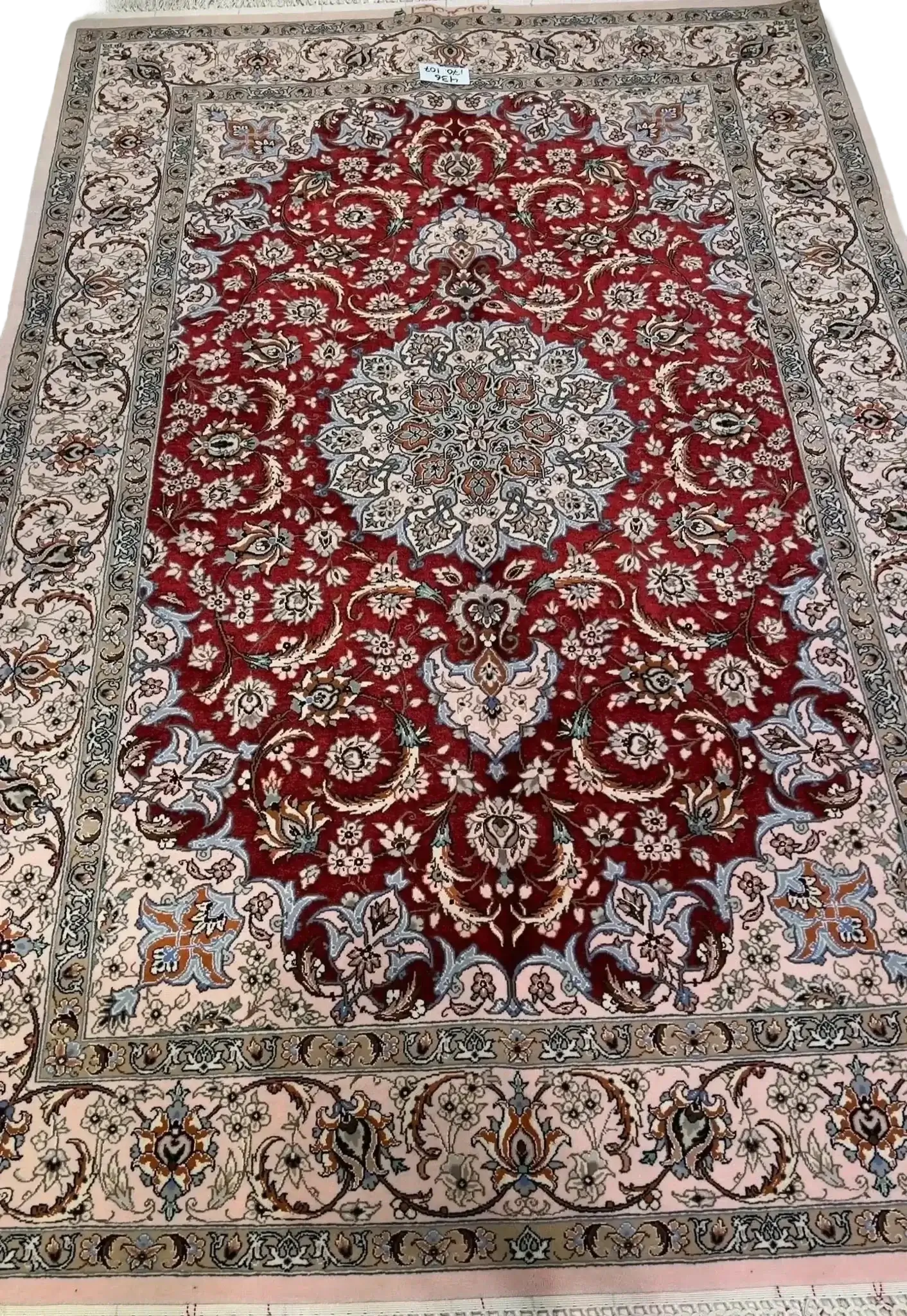 "Authentic Isfahan Persian rug woven by master artisan Taghiezadeh. This silk and wool area rug, measuring 170 cm x 107 cm, offers intricate craftsmanship with a knot density of 810,000 knots per square meter. Buy this luxurious Persian carpet online to add elegance to any space."