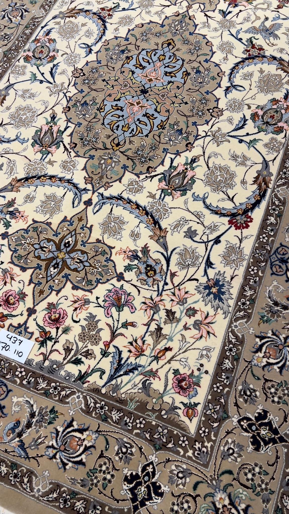 Hand-knotted Persian rug with intricate floral patterns